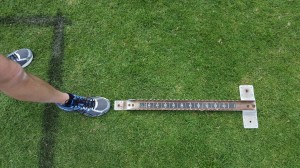 Place the starting blocks one foot-length behind the start line