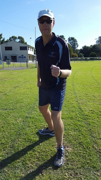 Individual in an "Set" standing position with their back foot pointed to the side