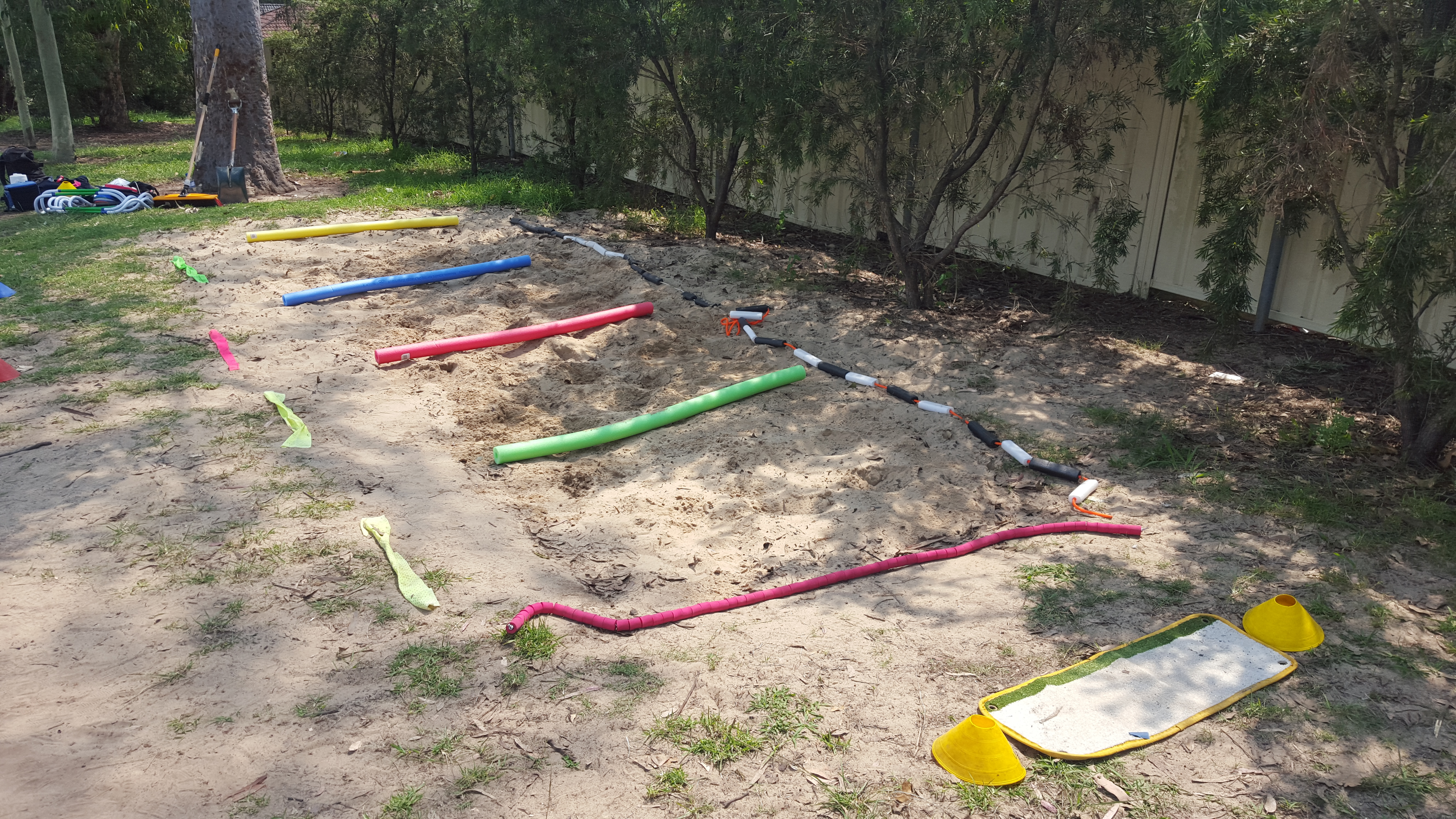 Long jump pit divided by pool noodles