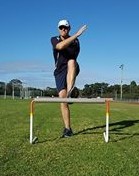 Hurdler incorrectly crossing their lead arm over their opposite shoulder