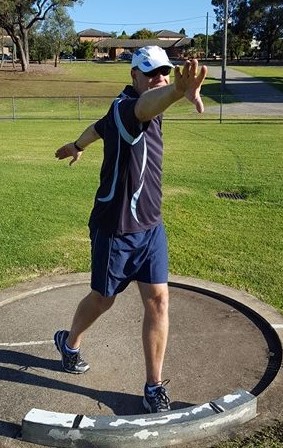 hot putter swinging non-throwing arm behind themselves