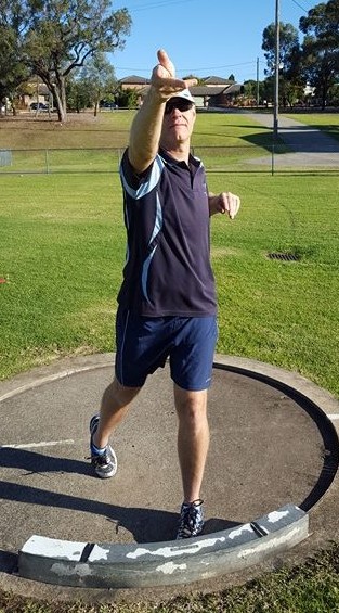 Shot putter twisting hand on release of the shot