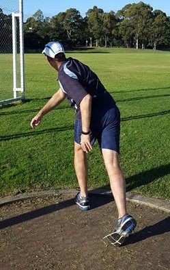 Discus thrower incorrectly bowling the discus